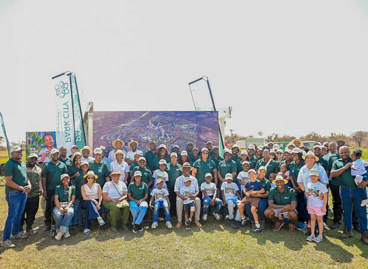 Guests and the Park City team photographed in front of the Phase One banner